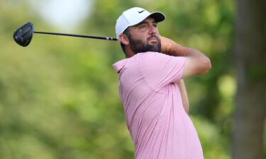 Scottie Scheffler plays a tee shot during the third round of the BMW Championship on Saturday.
