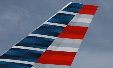 The tail of an American Airlines plane is seen at the Miami International Airport in July 2023. An American Airlines plane blew two tires while taxiing for departure at Chicago’s O’Hare International Airport on August 26