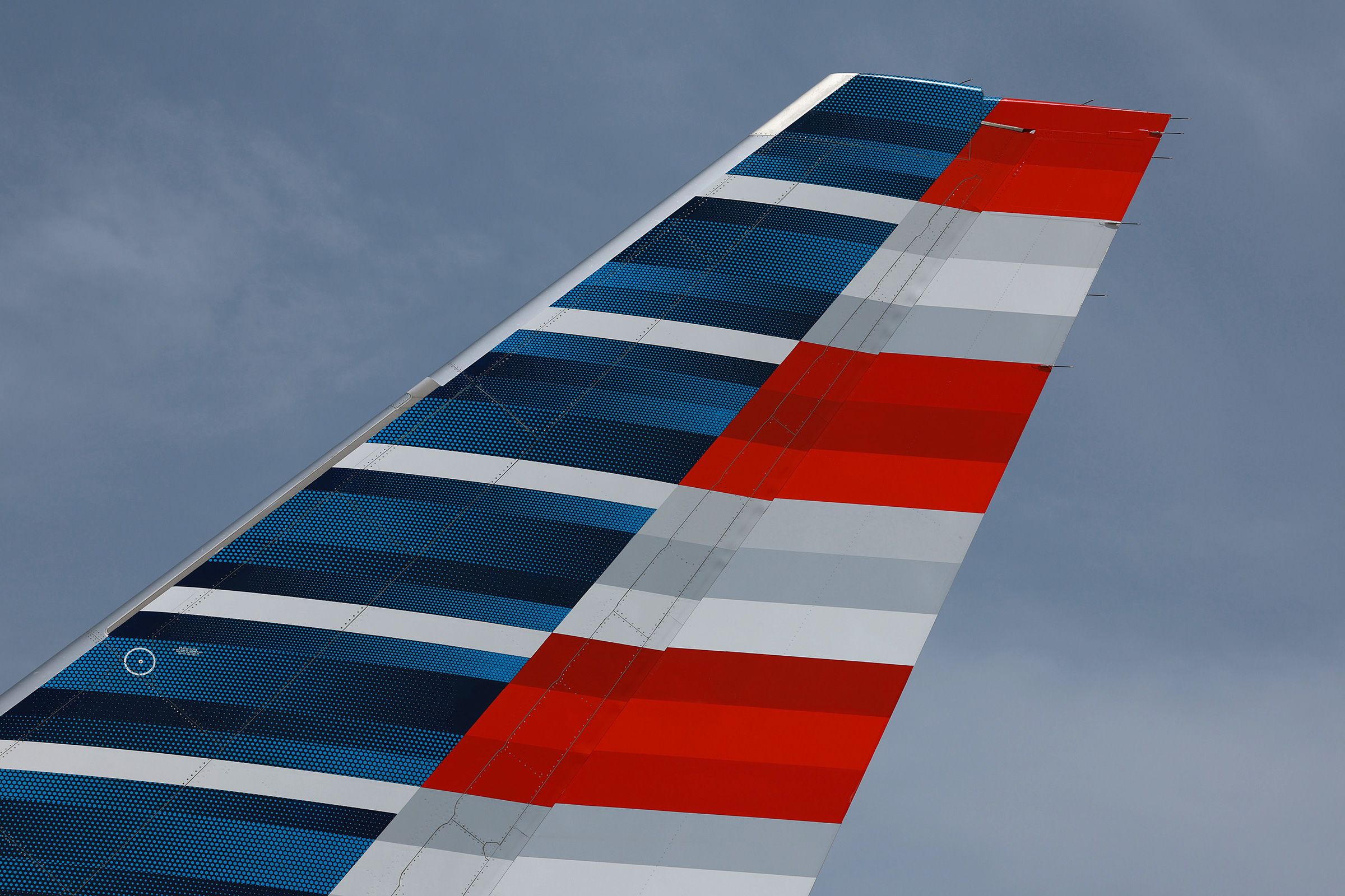 <i>Joe Raedle/Getty Images/File via CNN Newsource</i><br/>The tail of an American Airlines plane is seen at the Miami International Airport in July 2023. An American Airlines plane blew two tires while taxiing for departure at Chicago’s O’Hare International Airport on August 26