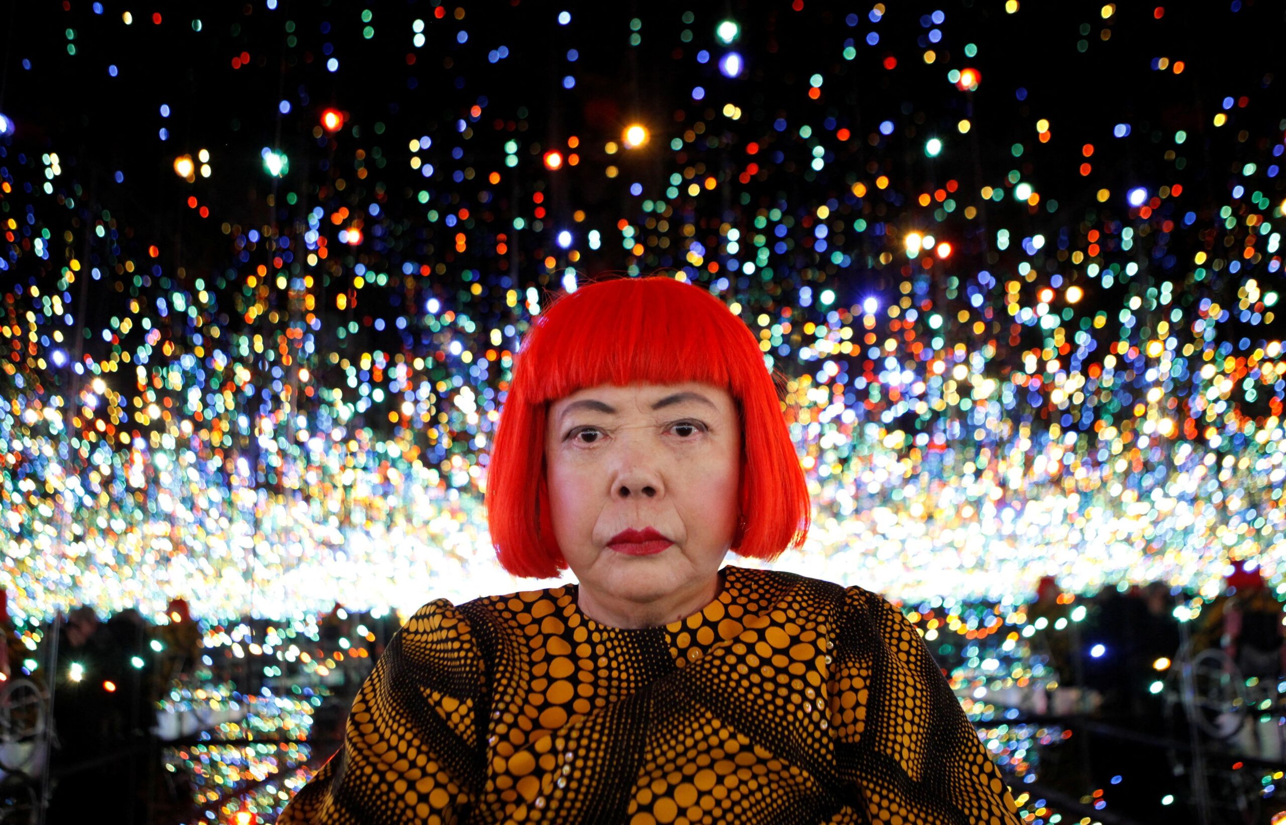 <i>Mike Segar/Reuters via CNN Newsource</i><br/>Japanese artist Yayoi Kusama poses for a photograph inside her Infinity Mirrored Room installation titled 