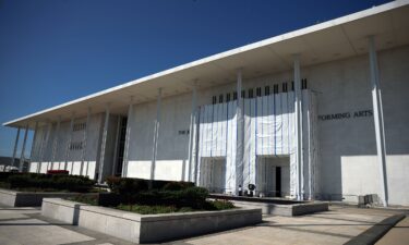 A tarp remains in place on the facade of the John F. Kennedy Center for the Performing Arts in Washington