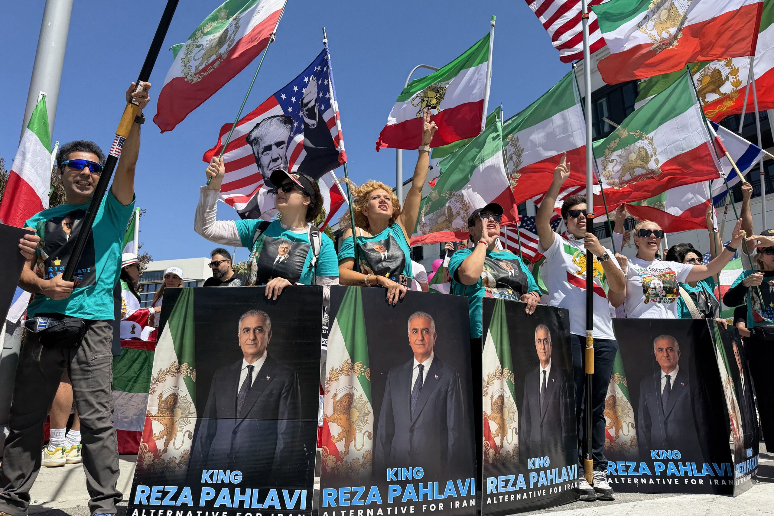 <i>Mandel Ngan/AFP/Getty Images via CNN Newsource</i><br/>A protester waves an Iranian flag and shouts slogans during a demonstration against US military action in Iran near the White House