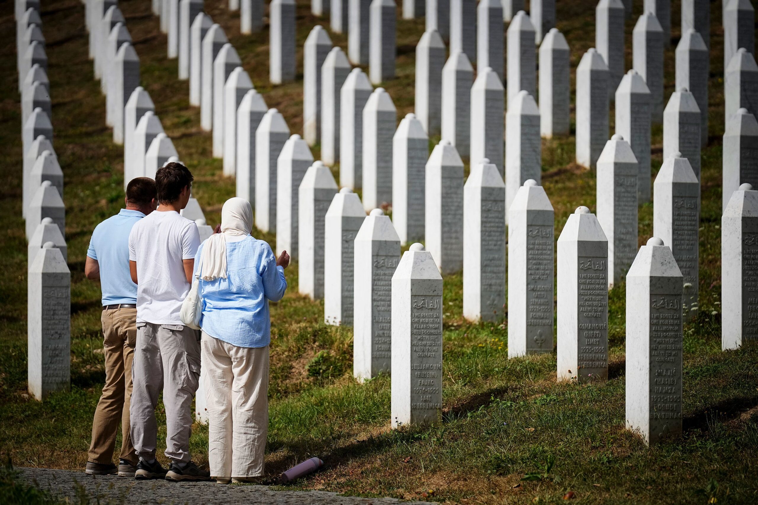 <i>Nidal Saljic/AFP/Getty Images via CNN Newsource</i><br/>Visitors stand at the memorial cemetery in the village of Potocari