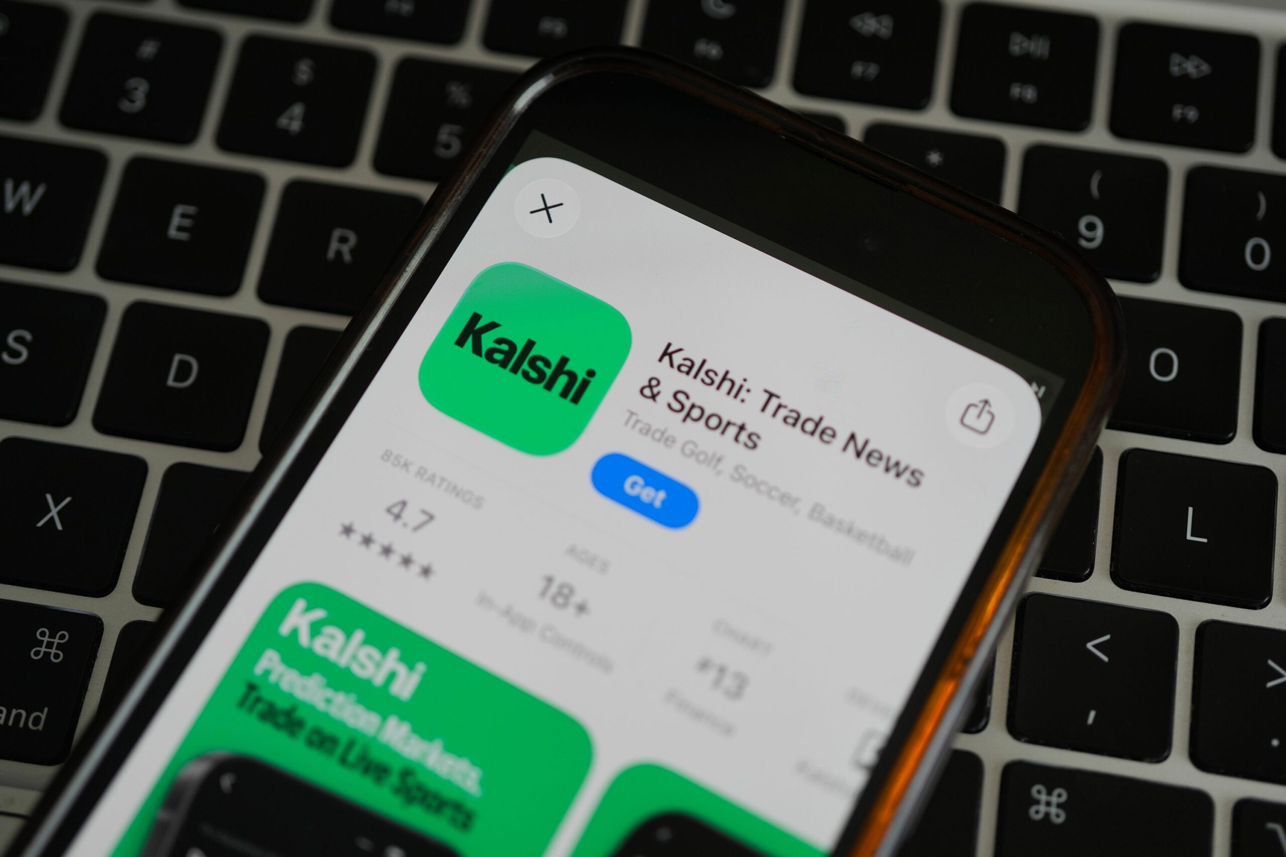 <i>Erin Hooley/AP via CNN Newsource</i><br/>An ad for the prediction market app Kalshi is displayed on a mobile phone in Chicago on April 16. A federal appeals court ruled Friday that states can regulate prediction markets like gambling.