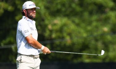 Young lines up a putt on the eighth green during the second round of the Tour Championship 2026 at East Lake Golf Club in Atlanta