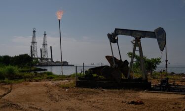 A Petroleos de Venezuela SA (PDVSA) oil pumpjack on Lake Maracaibo in Cabimas