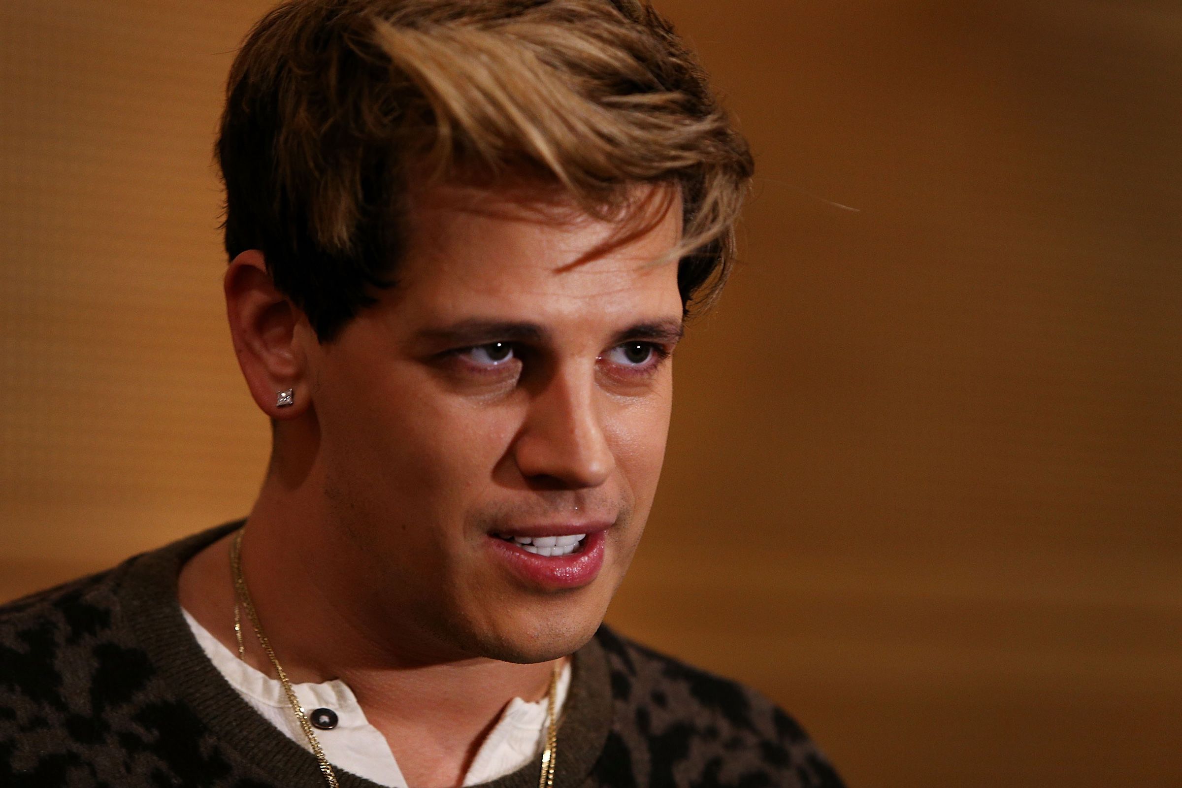 <i>Lisa Maree Williams/Getty Images/File via CNN Newsource</i><br/>Milo Yiannopoulos reacts during a press conference on arrival at the Sydney International Airport on November 29