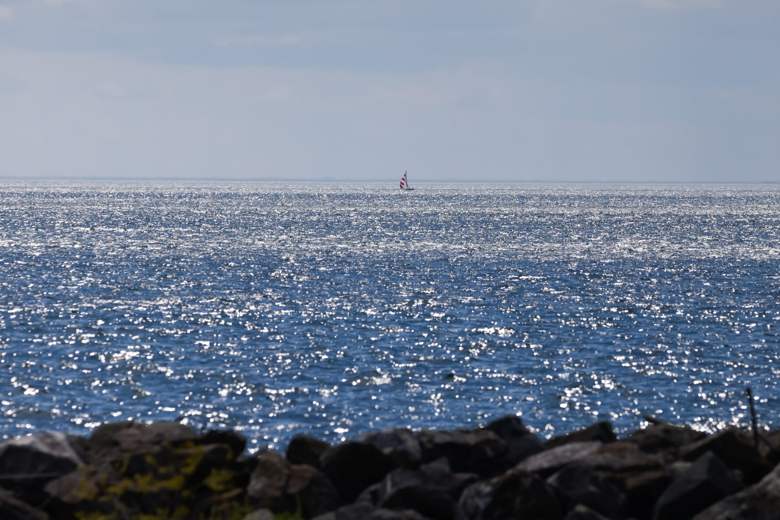 <i>Cole Bustone/AFP/Getty Images via CNN Newsource</i><br/>A sailboat is seen in the distance on Lake Ontario