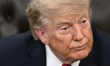 President Donald Trump looks on during an event in the Oval Office of the White House on August 31.