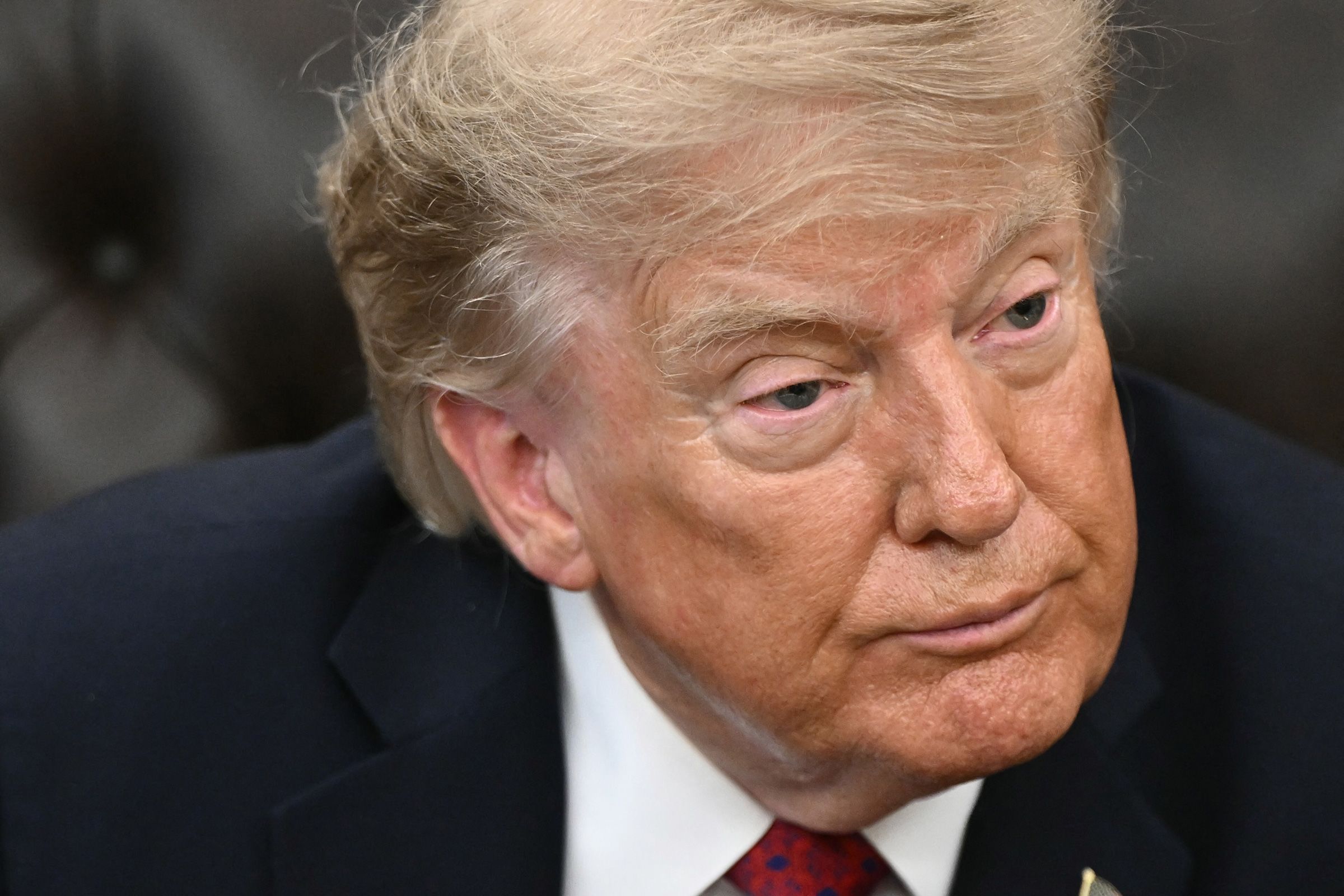 <i>Brendan Smiwalowski/AFP/Getty Images via CNN Newsource</i><br/>President Donald Trump looks on during an event in the Oval Office of the White House on August 31.