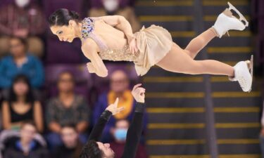 Canada's Deanna Stellato-Dudek (top) and Maxime Deschamps compete in their free skate in the pairs event during the ISU Four Continents Figure Skating Championships 2023 at the Broadmoor World Arena in Colorado Springs