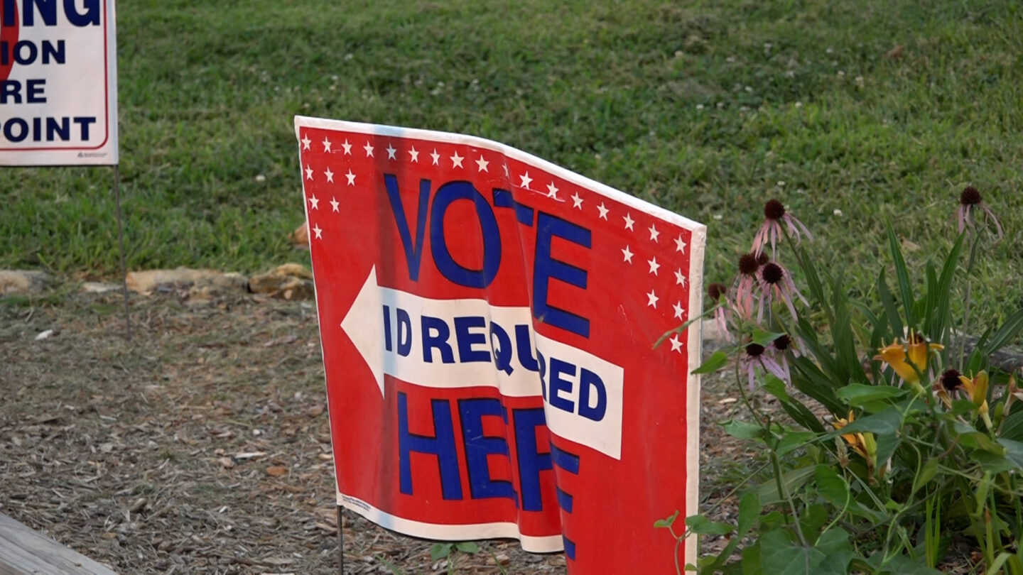 A voter sign is featured in the photo 