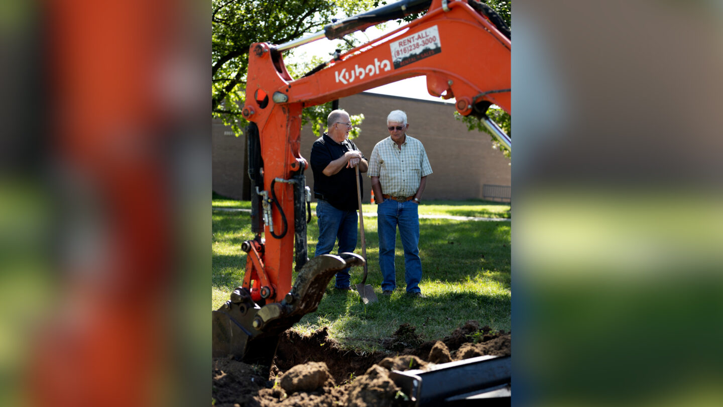 Brian Harrah, assistant director of physical plant, buildings and grounds, and Bruce Whitsell, retired grounds supervisor, participate in the unearthing of the 1990 time capsule on Sept. 14, 2026. 