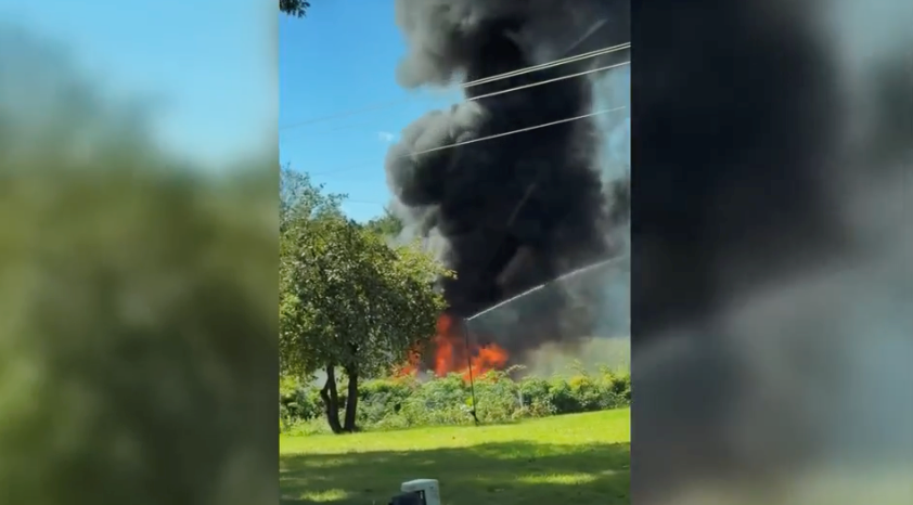 <i>Shellie Doornbos via CNN Newsource</i><br/>Witness video captures the aftermath of a military F-16 fighter jet crash in Michigan on September 17.