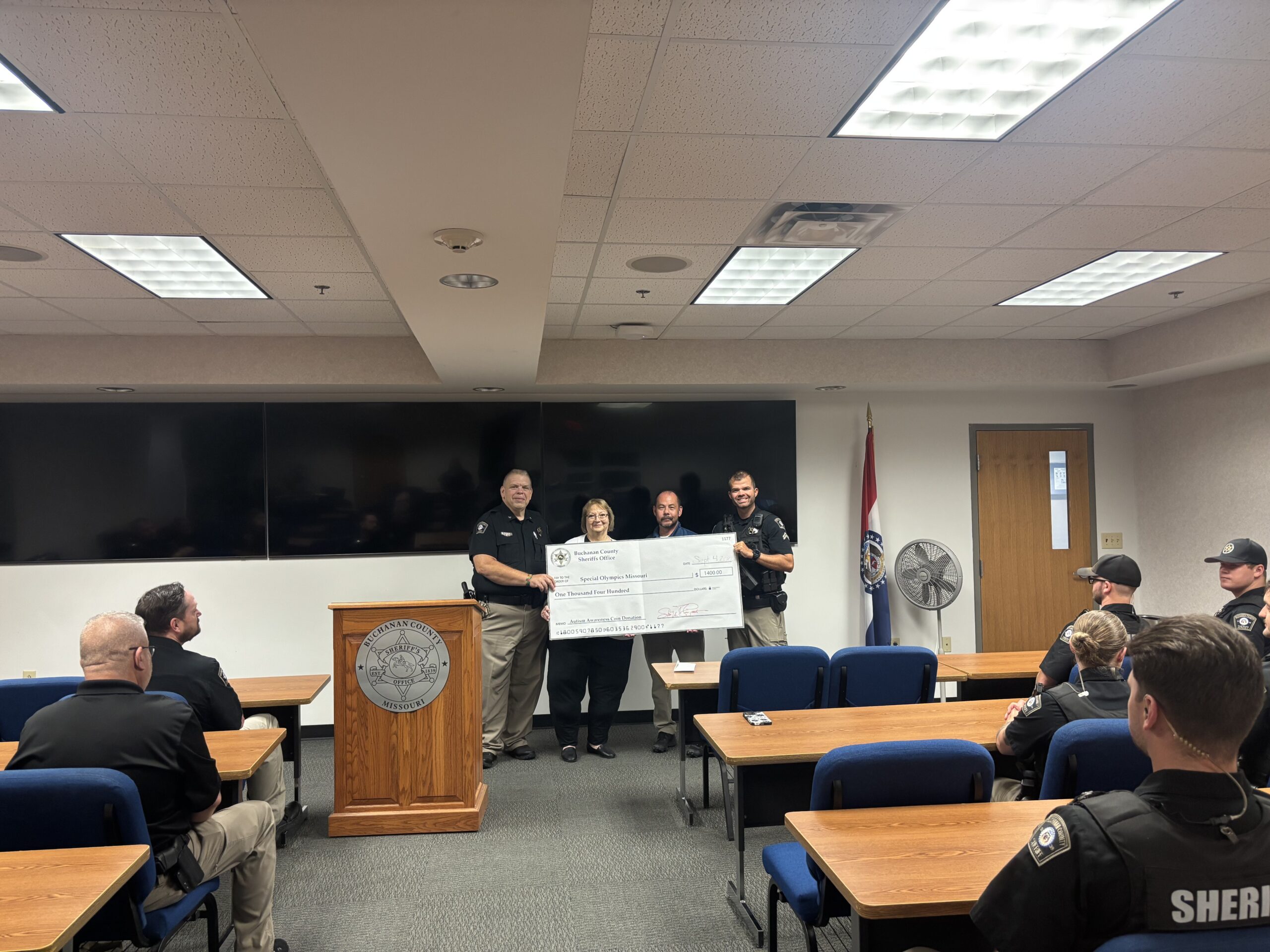 The Buchanan County Sheriff Office with the  Special Olympics development director.