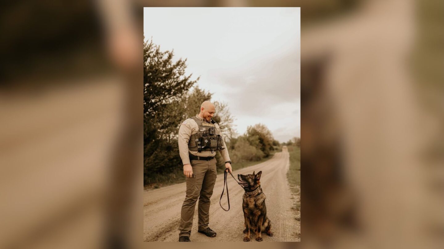 Nodaway County Sheriff Austin Hann stands with his companion, K9 Bolt, in this photo.