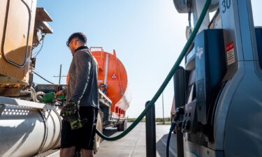 A person refuels their semi-truck in Notrees