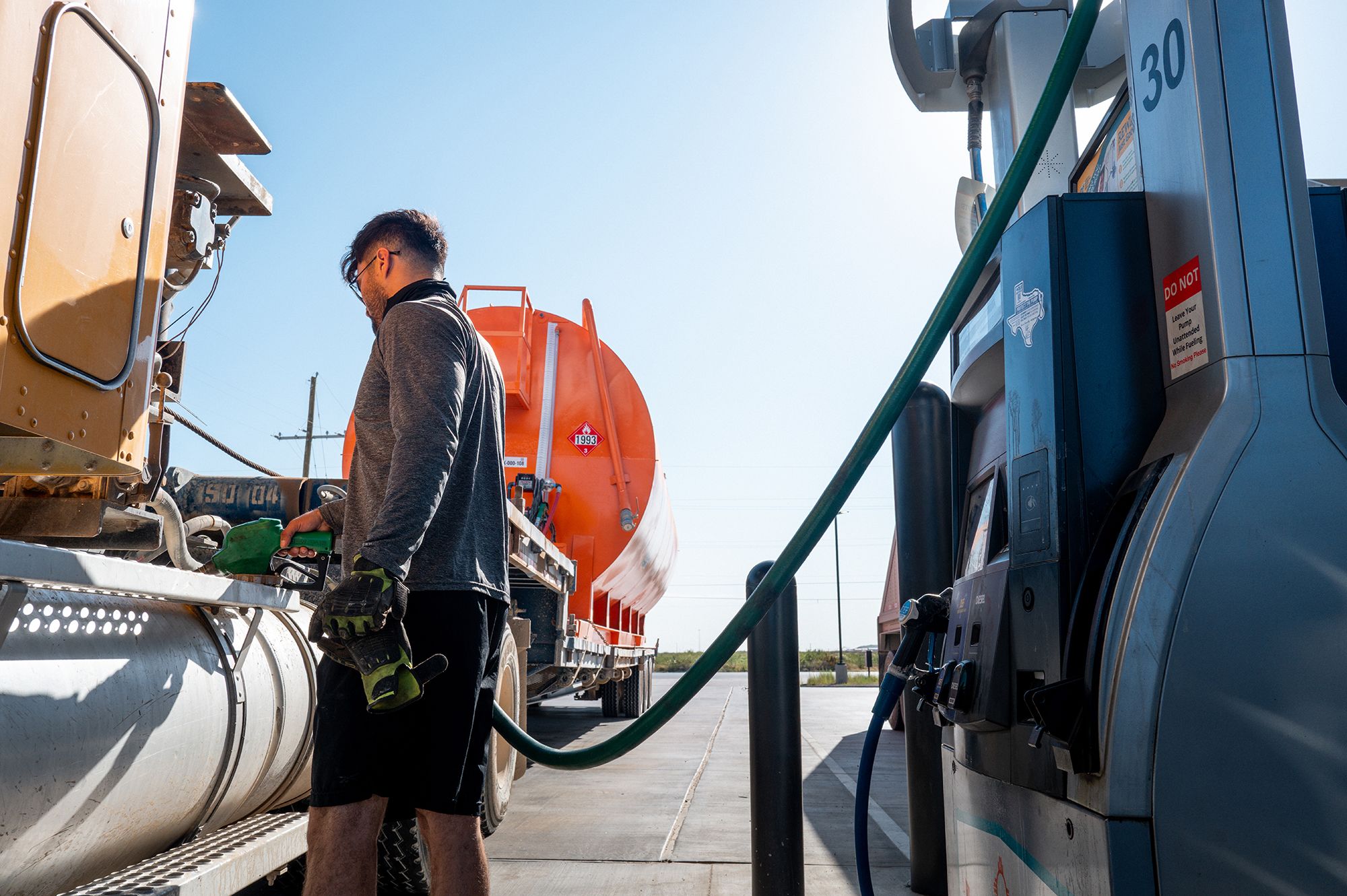<i>Brandon Bell/Getty Images via CNN Newsource</i><br/>A person refuels their semi-truck in Notrees