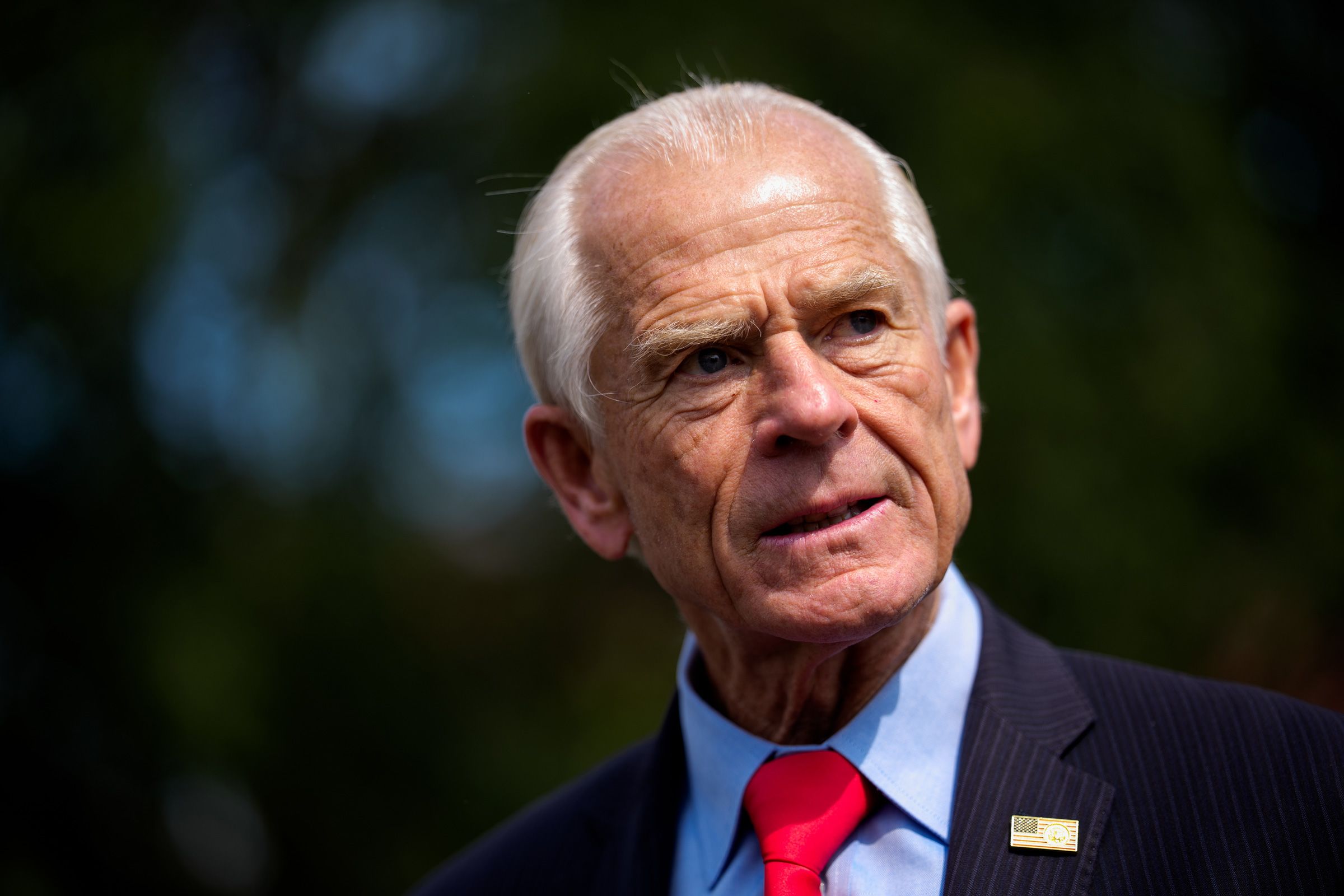 <i>Andrew Harnik/Getty Images via CNN Newsource</i><br/>White House senior counselor for trade and manufacturing Peter Navarro takes a question from a reporter on August 11