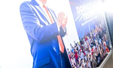 A picture of Donald Trump at a rally is seen in an elevator