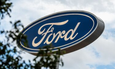 A low-angle close-up view shows the corporate Ford Blue Oval logo signage in Santaquin