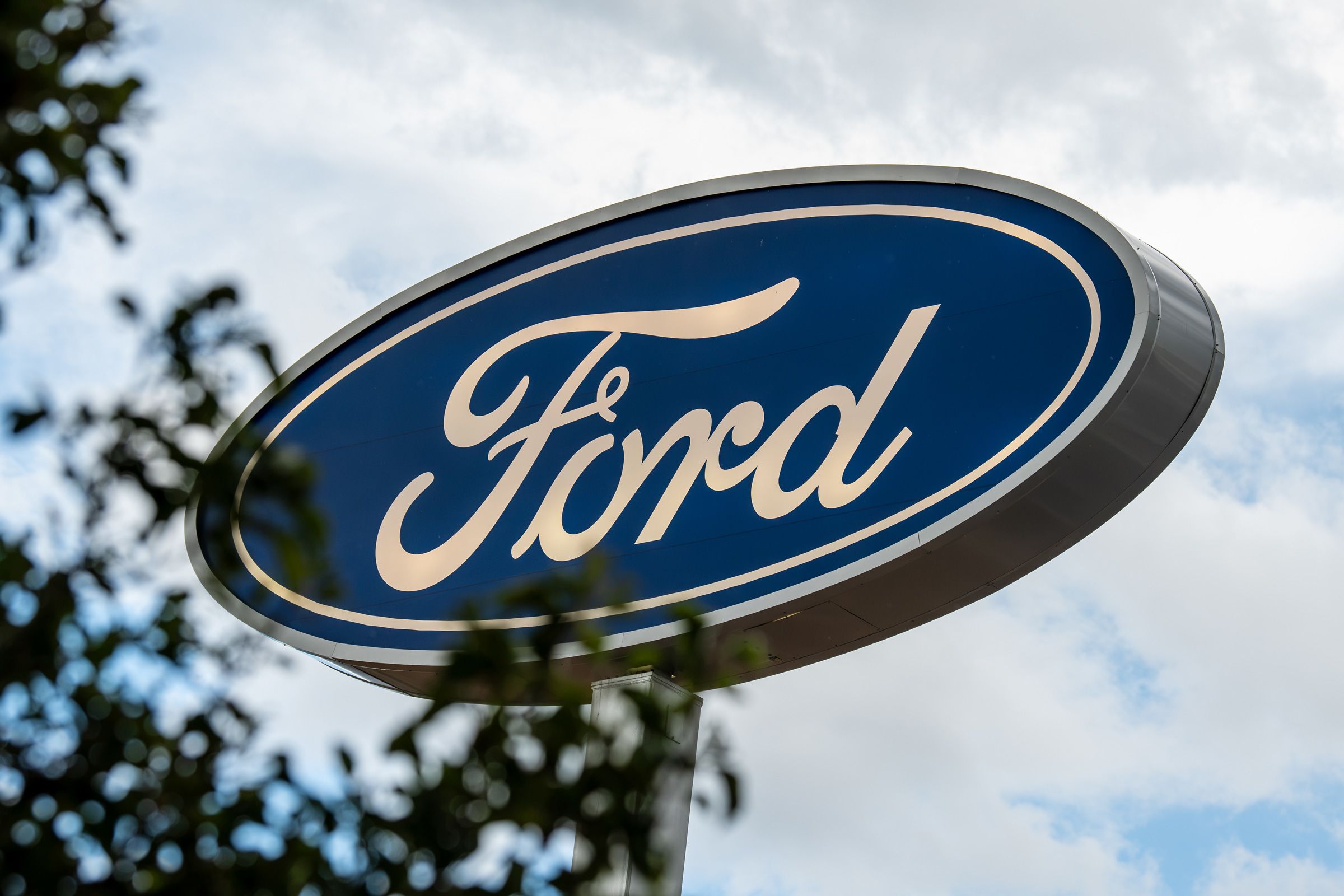 <i>Charles-McClintock Wilson/NurPhoto/Getty Images via CNN Newsource</i><br/>A low-angle close-up view shows the corporate Ford Blue Oval logo signage in Santaquin