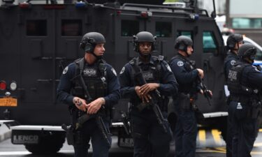 Members of the FBI Joint Terrorism Task Force stand by to provide security for the Gay Pride Parade on June 12
