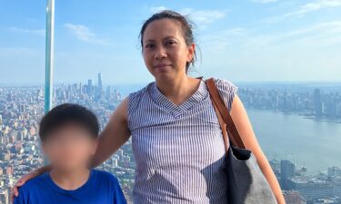 Antoinette Forbes is seen in an image with her son. A portion of this image has been blurred by the source.