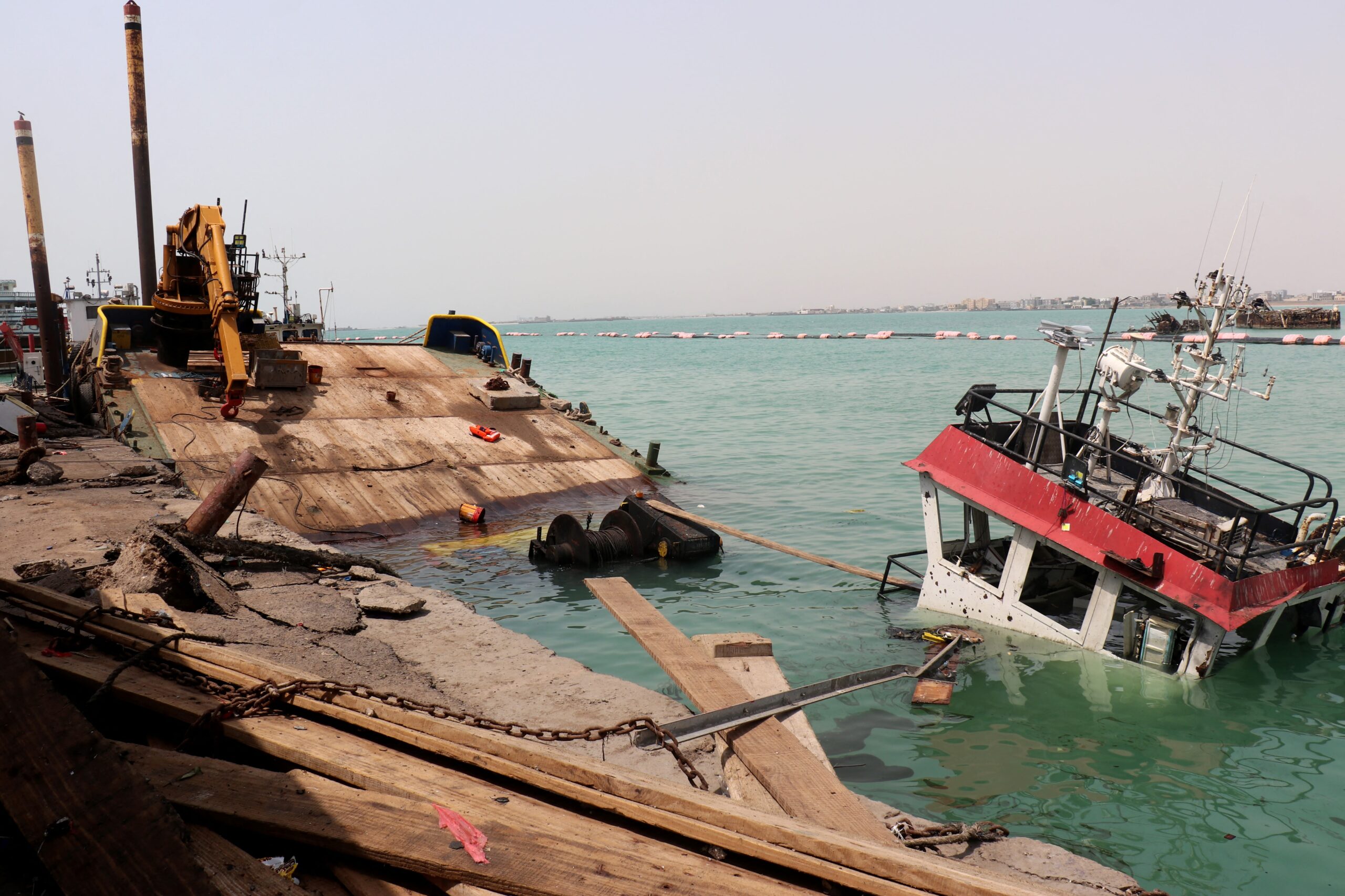 <i>Khaled Ziad/AFP/Getty Images via CNN Newsource</i><br/>A sunken vessel is seen at the surface of the water in the port of Mocha the day after an attack by the Houthis on August 9. Strikes by the Iran-backed Houthi rebels have been happening on Yemen's west coast for weeks.