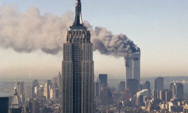 The twin towers of the World Trade Center burn on September 11