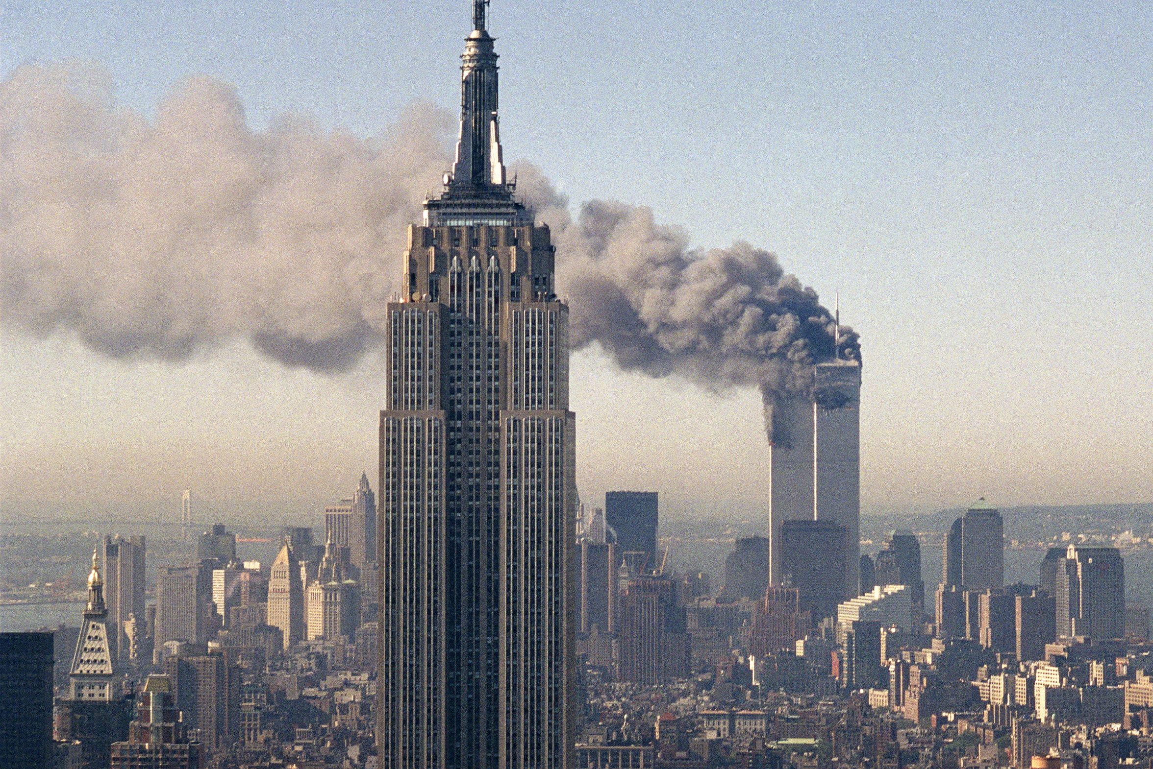 <i>Marty Lederhandler/AP via CNN Newsource</i><br/>The twin towers of the World Trade Center burn on September 11