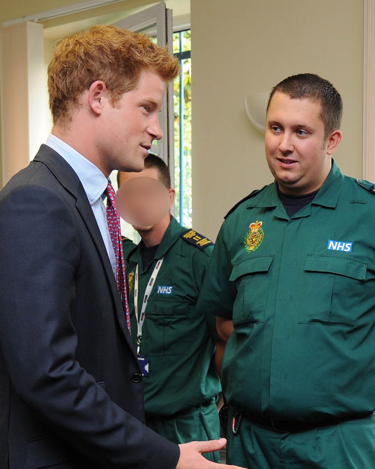<i>Jim Clarke/WPA Pool/Getty Images/File via CNN Newsource</i><br/>Prince Harry speaks to ambulance crew members