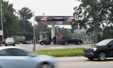 Cars drive past a Freedom Fuel Network gas station in Boothwyn