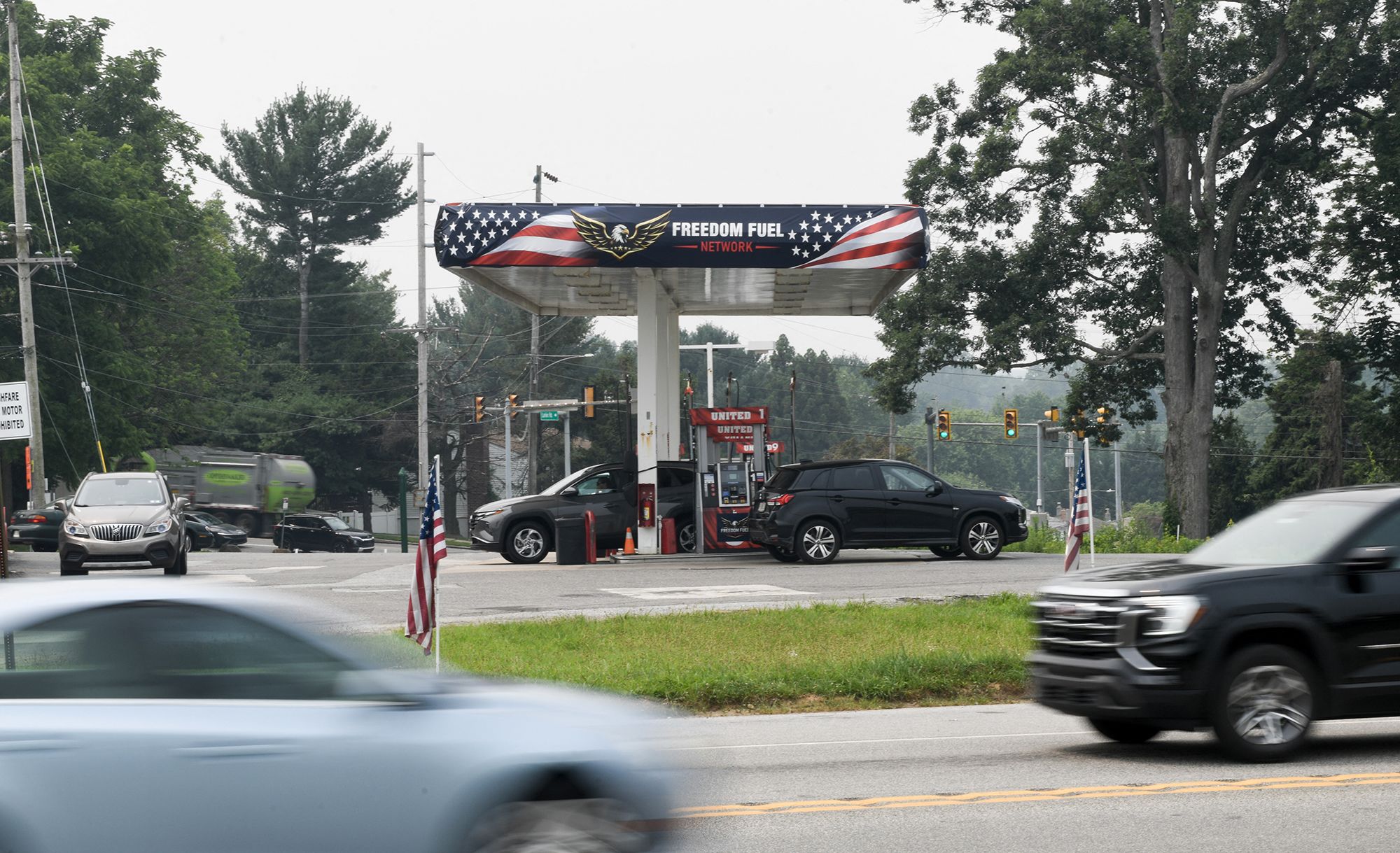 <i>Matthew Hatcher/AFP/Getty Images via CNN Newsource</i><br/>Cars drive past a Freedom Fuel Network gas station in Boothwyn