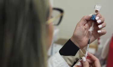 Pharmacy manager Aylen Amestoy prepares to give a respiratory syncytial virus vaccine at a CVS Pharmacy in Miami in 2025. RSV