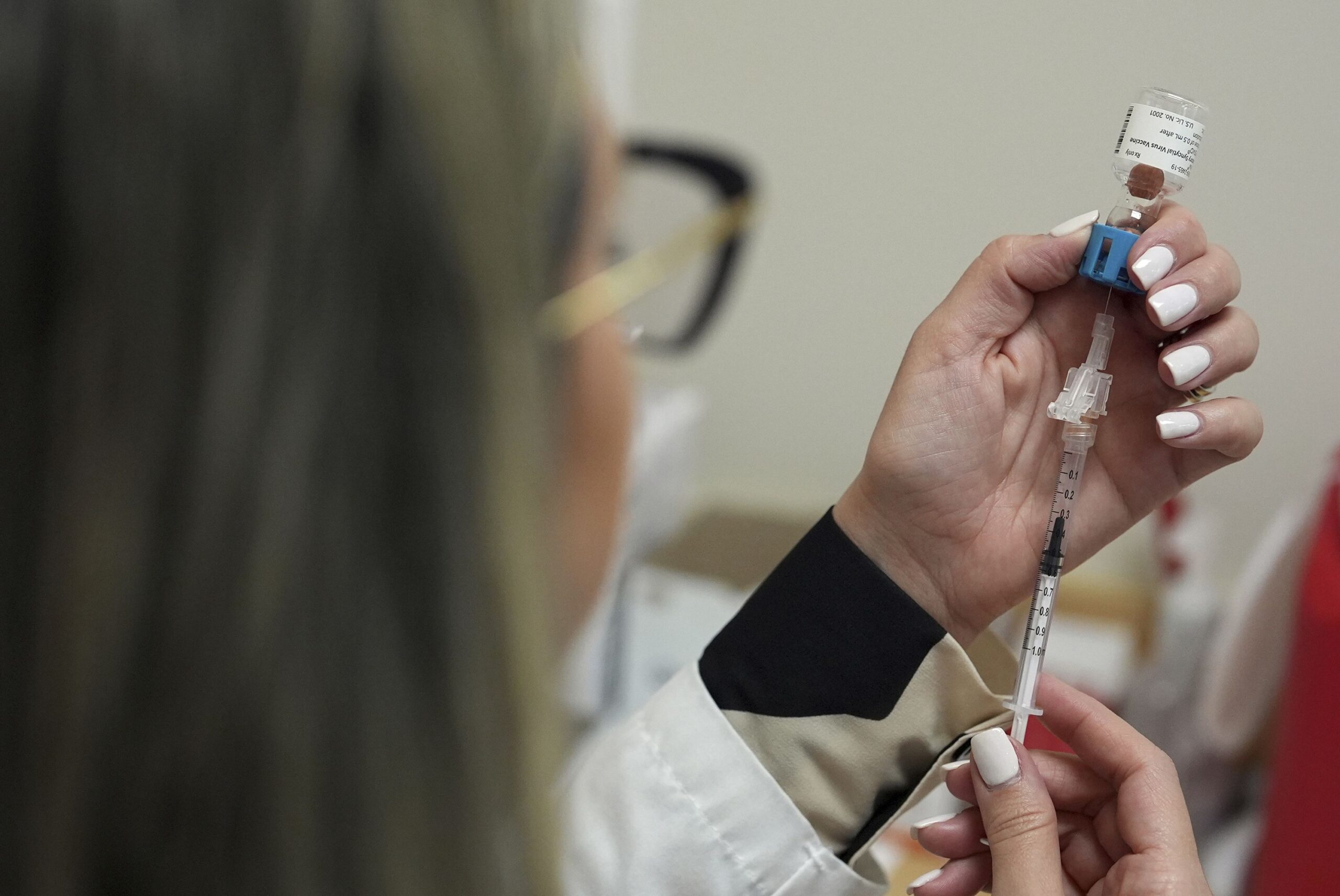 <i>Rebecca Blackwell/AP via CNN Newsource</i><br/>Pharmacy manager Aylen Amestoy prepares to give a respiratory syncytial virus vaccine at a CVS Pharmacy in Miami in 2025. RSV