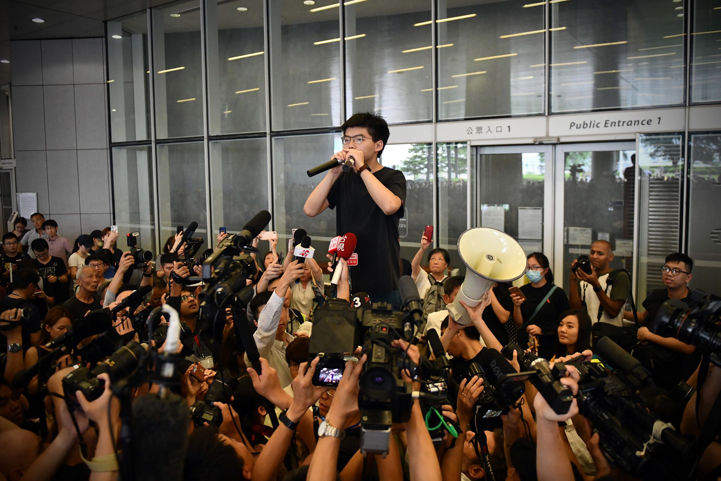 <i>Anthony Kwan/Getty Images via CNN Newsource</i><br/>Hong Kong activist Joshua Wong prepares to board a prison van in 2020 in Hong Kong.