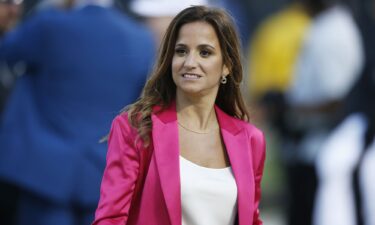 ESPN reporter Dianna Russini on the sidelines before the start of an NFL football game between the Oakland Raiders and the Denver Broncos September 9