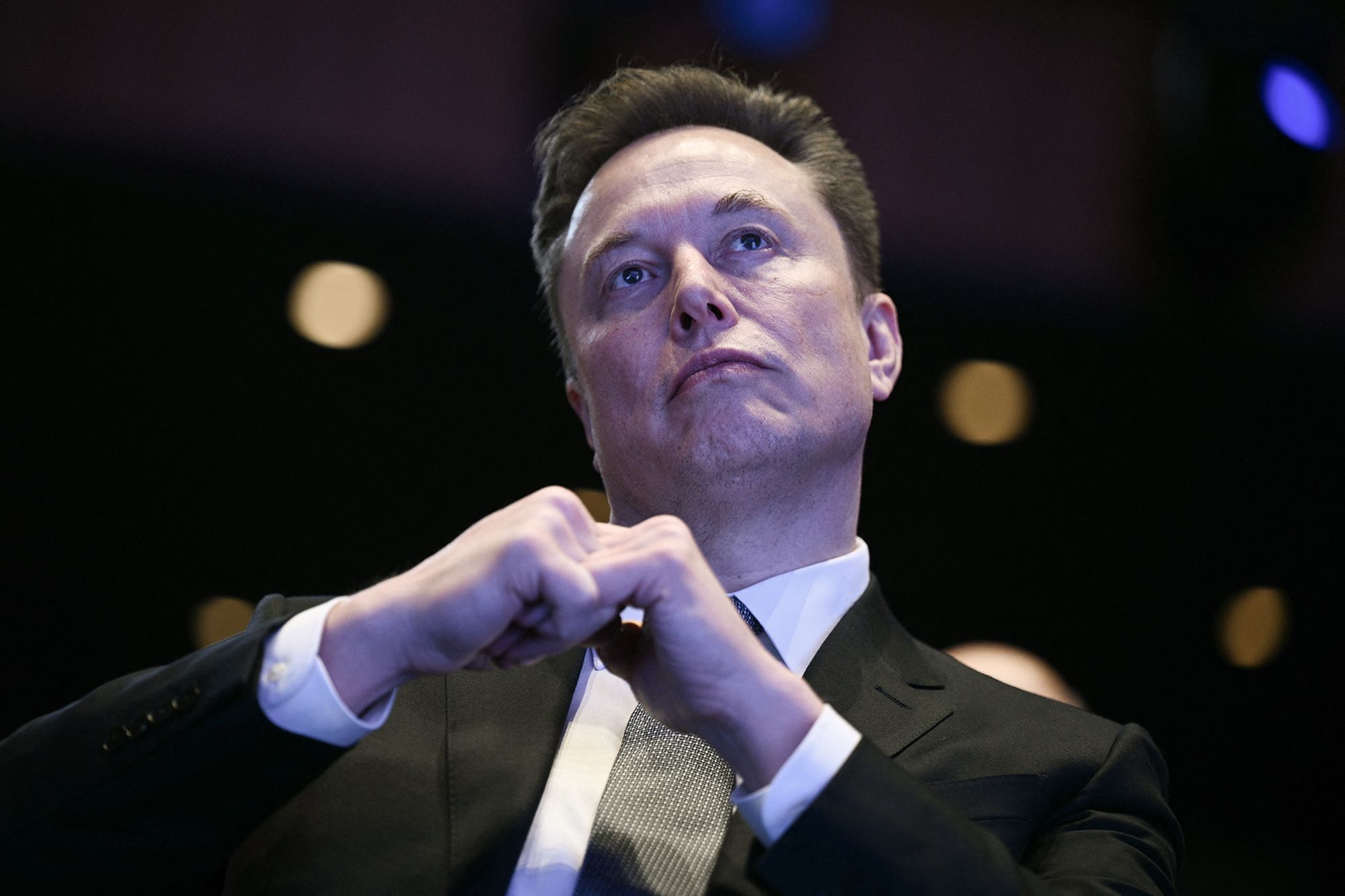 <i>Brendan Smialowski/AFP/Getty Images via CNN Newsource</i><br/>Elon Musk looks on as President Donald Trump speaks in Washington