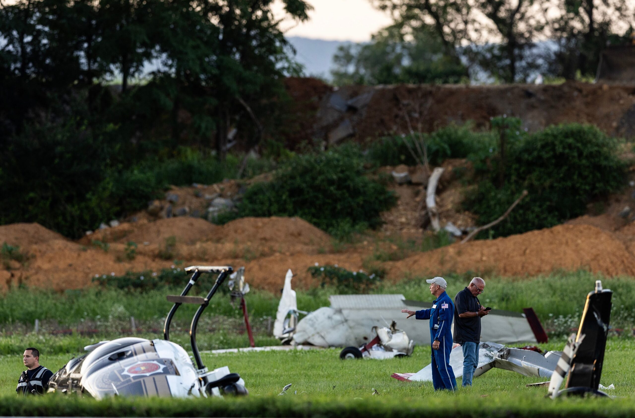 <i>Sean Simmers/The Patriot-News/AP via CNN Newsource</i><br/>Authorities investigate a crash between a Pennsylvania State Police helicopter and a small plane at the Carlisle airport in Carlisle