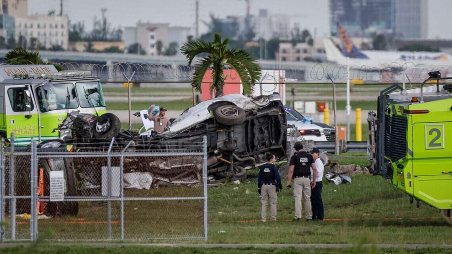 <i>Al Diaz/Miami Herald/Tribune New Service/Getty Images via CNN Newsource</i><br/>A vehicle lays twisted after an Amazon Air Boeing 767 overshot a runway Sunday at Miami International Airport.