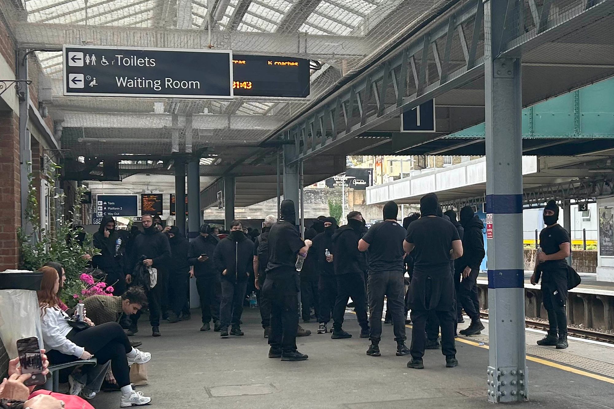 <i>PA/AP via CNN Newsource</i><br/>Police officers form a line to block protesters near Eastney Beach