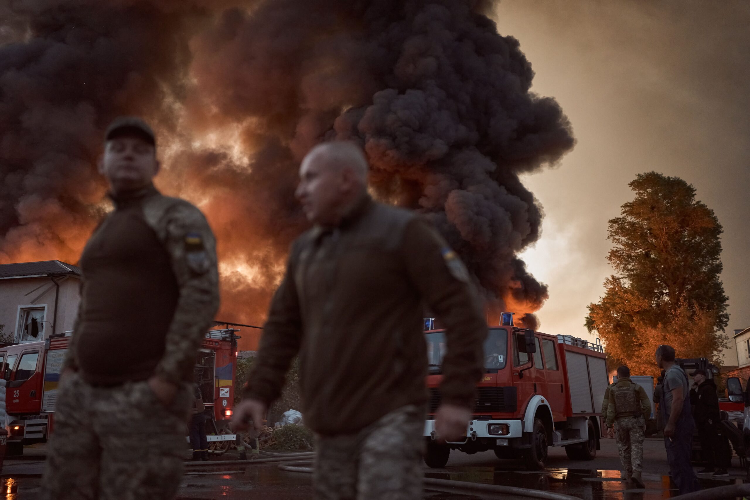 <i>Efrem Lukatsky/AP via CNN Newsource</i><br/>A firefighter listens to the sounds of a flying drone as he hides in a shelter in Kyiv