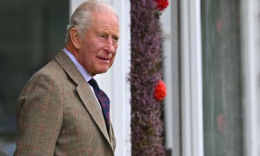 A screen displays a pre-recorded video message from Britain's King Charles III during the UK Artificial Intelligence (AI) Safety Summit at Bletchley Park