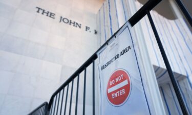 A sign is placed on a gate outside the John F. Kennedy Center for the Performing Arts in Washington