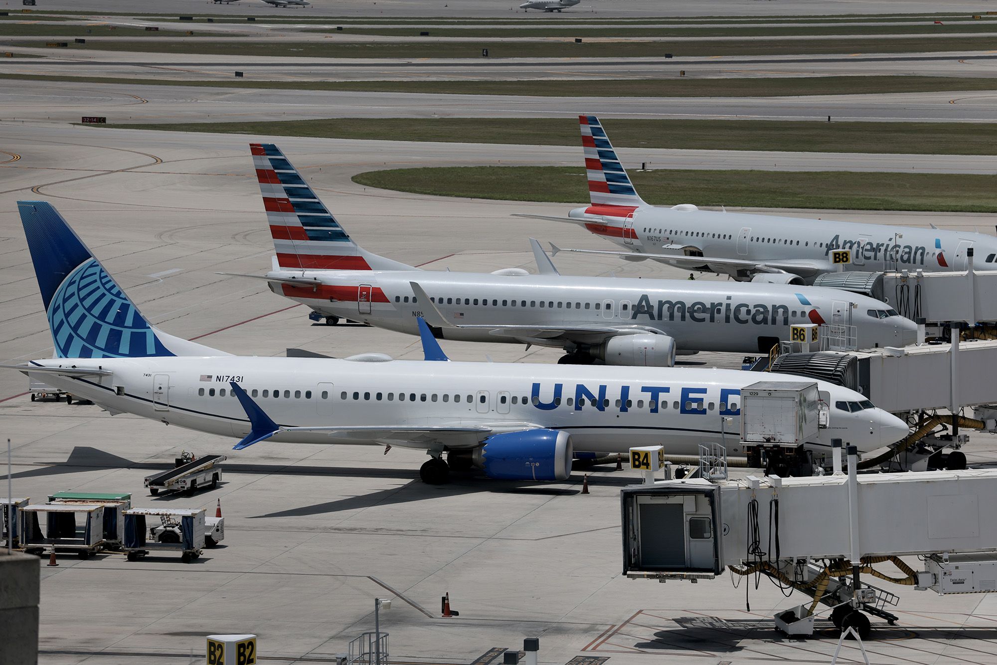<i>Joe Raedle/Getty Images via CNN Newsource</i><br/>Airplanes parked at their gates in Palm Beach