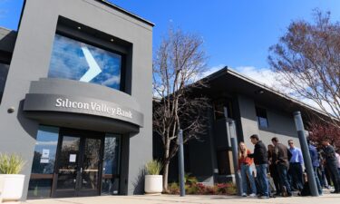 People wait outside the Silicon Valley Bank headquarters in Santa Clara