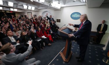 President Donald Trump takes questions from the media during a press briefing in the White House on January 20