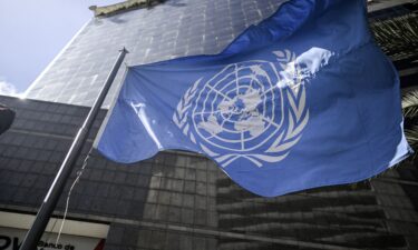 The United Nations flag waves in front of its office building on December 16