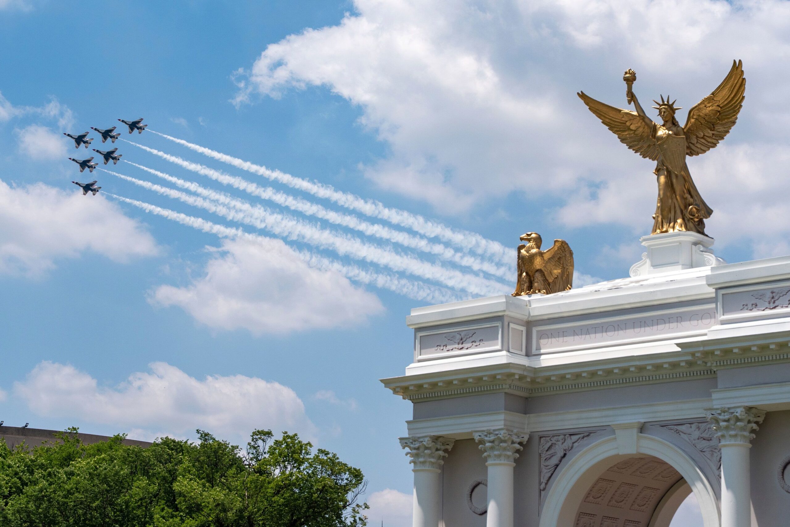 <i>Jen Golbeck/Sipa/AP via CNN Newsource</i><br/>The Air Force Thunderbirds fly past a mockup of President Donald Trump's proposed Triumphal Arch at the Great American State Fair on the National Mall as part of 